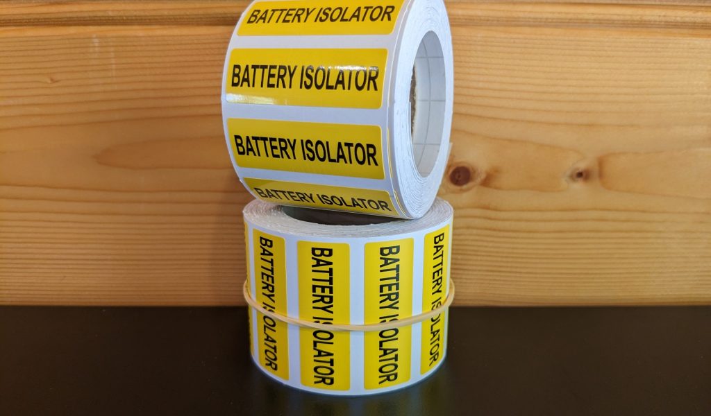 Battery Isolator labels on a roll.