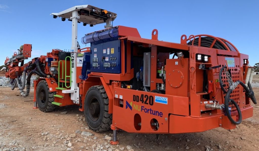 DD420 Undeground driller, on site, with safety and warning labels